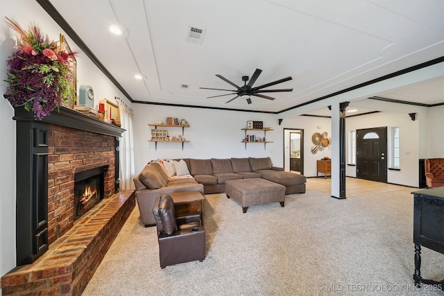 1018 W Evergreen St, Skiatook, OK 74070 - living room featuring ceiling fan, light carpet, a fireplace, recessed lighting, and crown molding