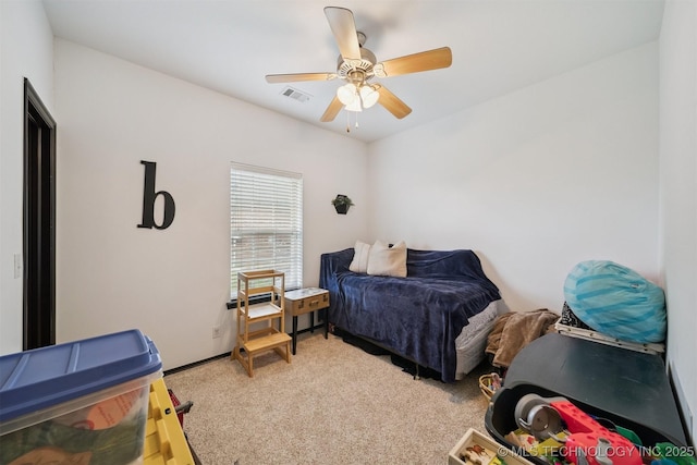 1018 W Evergreen St, Skiatook, OK 74070 - bedroom with light carpet and ceiling fan