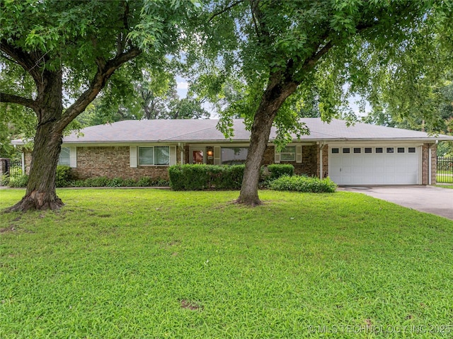 11420 S Mingo Rd, Bixby, OK 74008 - ranch-style home with an attached garage, concrete driveway, a front yard, and brick siding