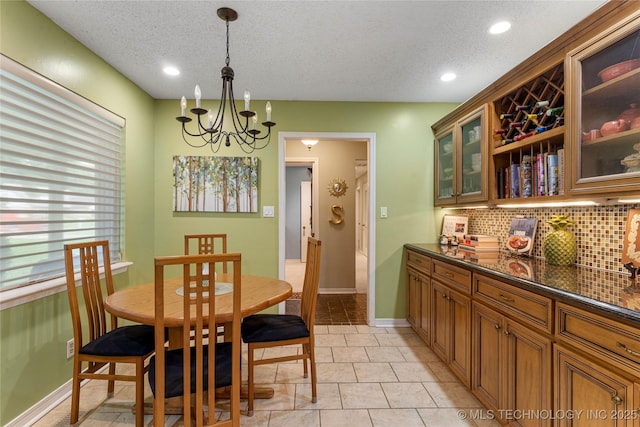 11420 S Mingo Rd, Bixby, OK 74008 - dining area featuring a textured ceiling, a chandelier, recessed lighting, and light tile patterned flooring