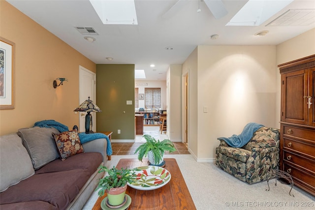11420 S Mingo Rd, Bixby, OK 74008 - living room with a skylight, a ceiling fan, and light carpet