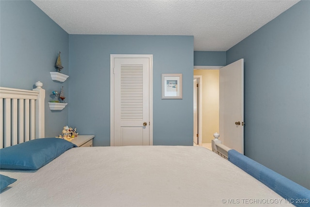 11420 S Mingo Rd, Bixby, OK 74008 - bedroom with a textured ceiling