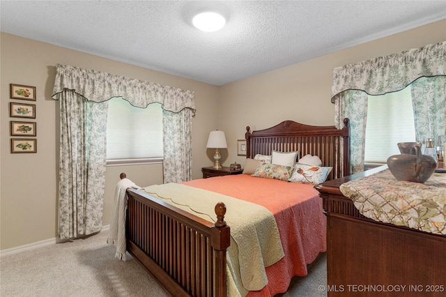 11420 S Mingo Rd, Bixby, OK 74008 - bedroom featuring multiple windows, carpet flooring, and a textured ceiling