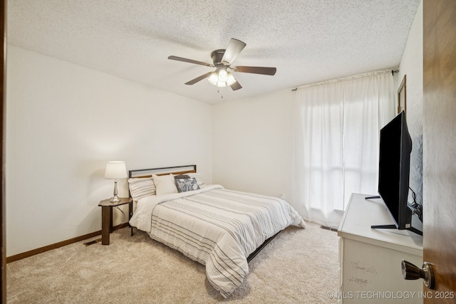 12526 S 12th St, Jenks, OK 74037 - bedroom featuring light colored carpet, multiple windows, ceiling fan, and a textured ceiling