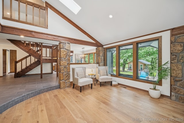 12526 S 12th St, Jenks, OK 74037 - sitting room featuring wood finished floors, stairway, a skylight, and high vaulted ceiling