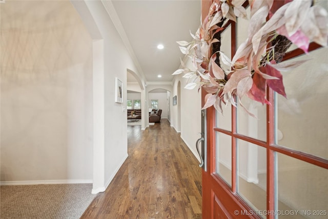 8404 E 98th Pl, Tulsa, OK 74133 - hall featuring arched walkways, ornamental molding, recessed lighting, and wood finished floors