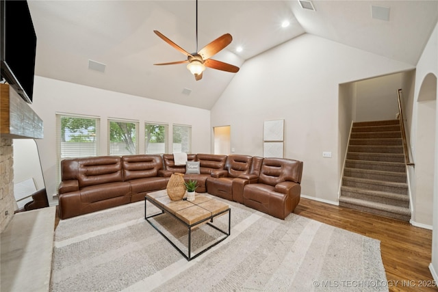 8404 E 98th Pl, Tulsa, OK 74133 - living area featuring a ceiling fan, wood finished floors, stairway, high vaulted ceiling, and a fireplace