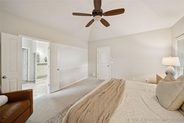 8404 E 98th Pl, Tulsa, OK 74133 - carpeted bedroom featuring vaulted ceiling, ensuite bath, and a ceiling fan