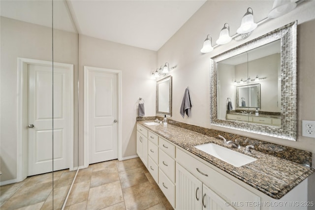 8404 E 98th Pl, Tulsa, OK 74133 - bathroom featuring double vanity and baseboards