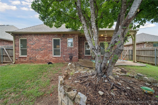 8404 E 98th Pl, Tulsa, OK 74133 - rear view of property with a patio, brick siding, a fenced backyard, and a shingled roof