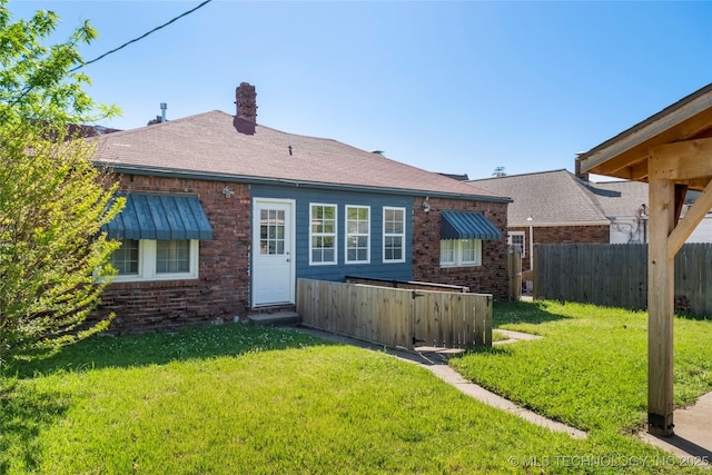 1510 S College Ave, Tulsa, OK 74104 - rear view of house with brick siding and a chimney