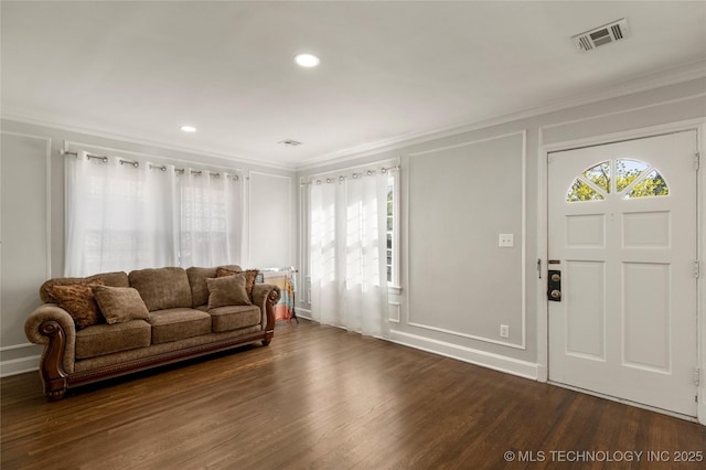 1510 S College Ave, Tulsa, OK 74104 - living room with ornamental molding, dark wood-type flooring, a decorative wall, and recessed lighting