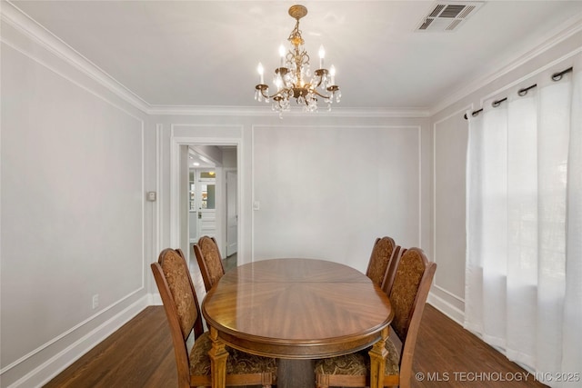 1510 S College Ave, Tulsa, OK 74104 - dining space with dark wood-style flooring, a chandelier, and ornamental molding