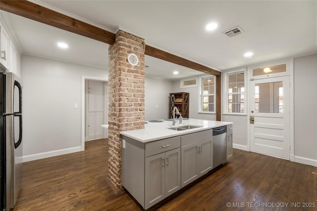 1510 S College Ave, Tulsa, OK 74104 - kitchen with stainless steel appliances, ornate columns, gray cabinets, dark wood-type flooring, and ornamental molding