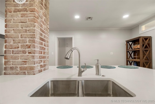 1510 S College Ave, Tulsa, OK 74104 - kitchen with crown molding, light countertops, and recessed lighting