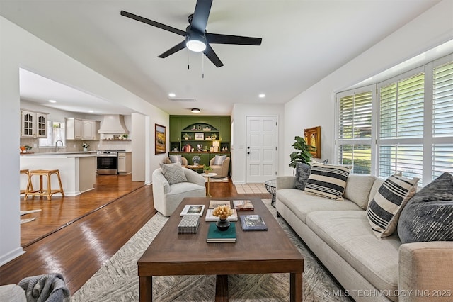 10 E 31st Pl, Sand Springs, OK 74063 - living area with plenty of natural light, wood finished floors, a ceiling fan, and recessed lighting