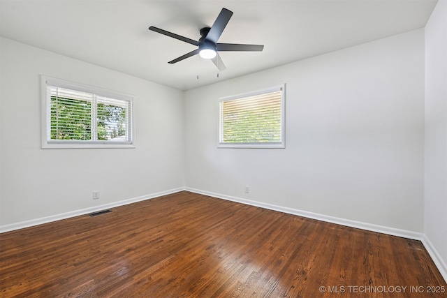 10 E 31st Pl, Sand Springs, OK 74063 - spare room with dark wood finished floors and a ceiling fan