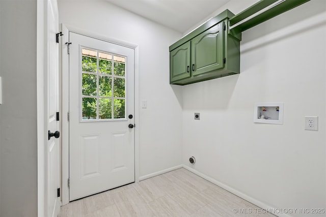 10 E 31st Pl, Sand Springs, OK 74063 - laundry area with electric dryer hookup, washer hookup, and cabinet space