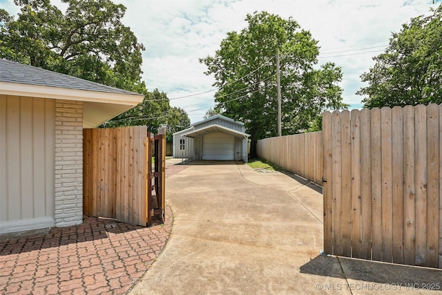10 E 31st Pl, Sand Springs, OK 74063 - view of patio / terrace with an outdoor structure and driveway