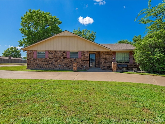 317 NE Autumn Ct, Bartlesville, OK 74006 - single story home featuring brick siding and a front lawn