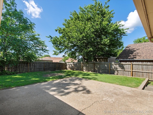 317 NE Autumn Ct, Bartlesville, OK 74006 - fenced backyard featuring a patio