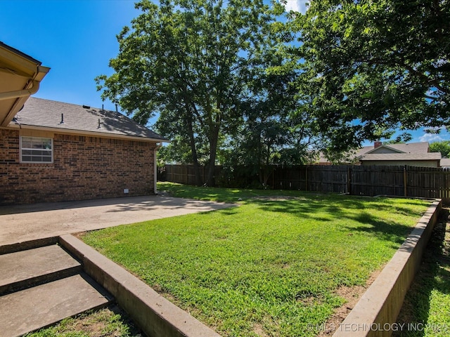 317 NE Autumn Ct, Bartlesville, OK 74006 - fenced backyard featuring a patio