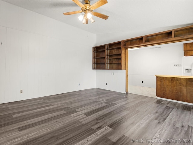 317 NE Autumn Ct, Bartlesville, OK 74006 - unfurnished living room featuring ceiling fan, dark wood-style flooring, and lofted ceiling