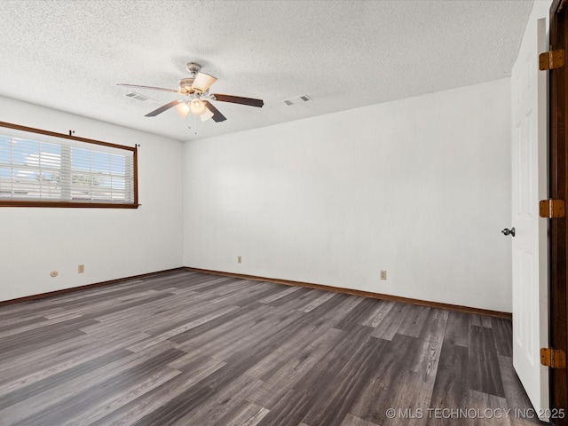 317 NE Autumn Ct, Bartlesville, OK 74006 - unfurnished room featuring dark wood-style floors, a ceiling fan, and a textured ceiling