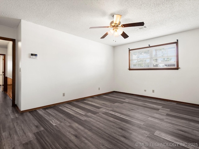 317 NE Autumn Ct, Bartlesville, OK 74006 - unfurnished room with dark wood-style floors, ceiling fan, and a textured ceiling