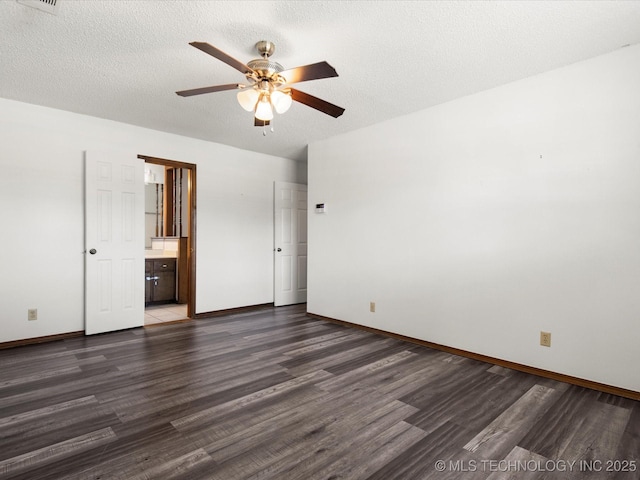 317 NE Autumn Ct, Bartlesville, OK 74006 - unfurnished bedroom featuring wood finished floors, a ceiling fan, ensuite bath, and a textured ceiling