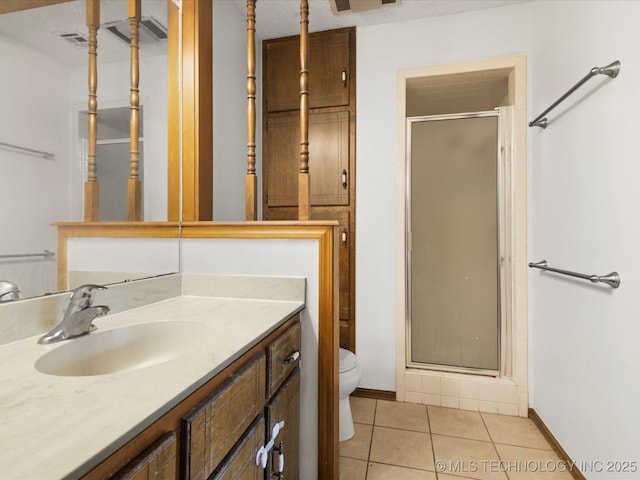 317 NE Autumn Ct, Bartlesville, OK 74006 - bathroom featuring tile patterned flooring, vanity, and a stall shower