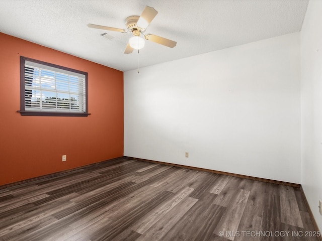 317 NE Autumn Ct, Bartlesville, OK 74006 - spare room featuring wood finished floors, ceiling fan, and a textured ceiling