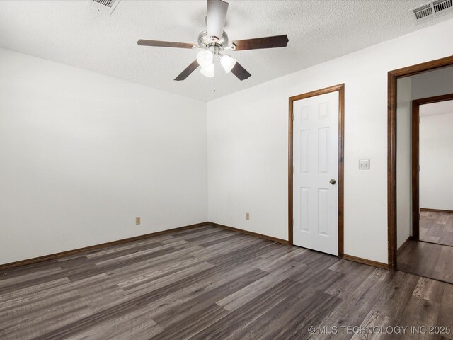 317 NE Autumn Ct, Bartlesville, OK 74006 - unfurnished bedroom featuring wood finished floors, ceiling fan, and a textured ceiling