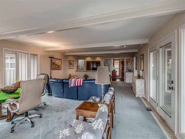 1201 Dogwood Ct, Bartlesville, OK 74006 - carpeted living room featuring crown molding, beam ceiling, and french doors