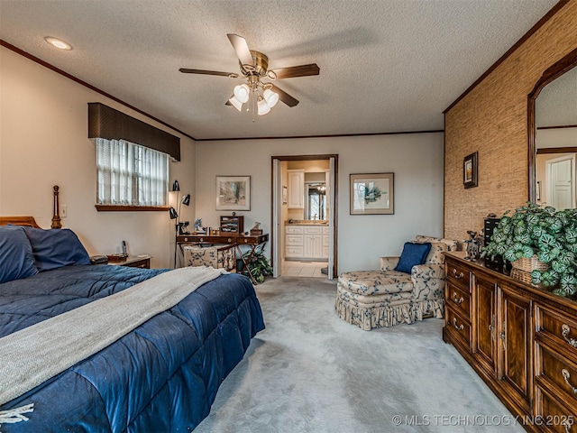 1201 Dogwood Ct, Bartlesville, OK 74006 - bedroom featuring light carpet, a textured ceiling, ensuite bathroom, crown molding, and a ceiling fan