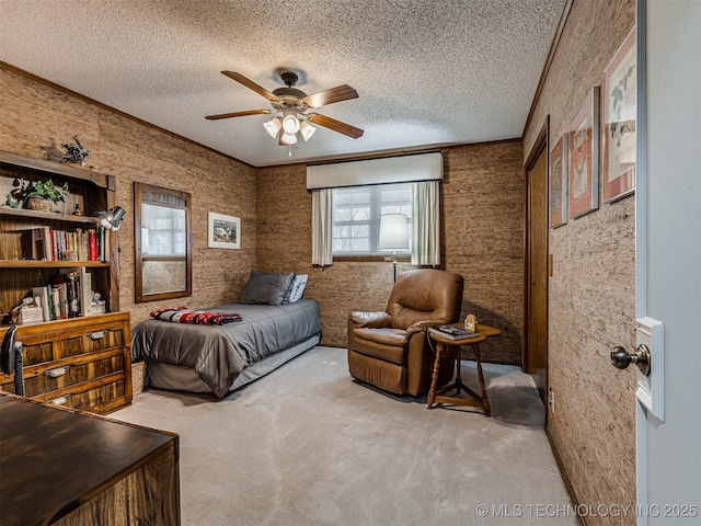 1201 Dogwood Ct, Bartlesville, OK 74006 - carpeted bedroom with multiple windows, a textured ceiling, and a ceiling fan