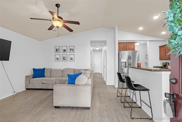8745 S 261st E Ave, Broken Arrow, OK 74014 - living area featuring lofted ceiling, a ceiling fan, light wood finished floors, and recessed lighting