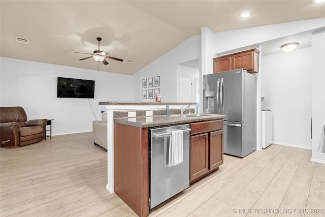 8745 S 261st E Ave, Broken Arrow, OK 74014 - kitchen with appliances with stainless steel finishes, open floor plan, vaulted ceiling, light wood finished floors, and ceiling fan