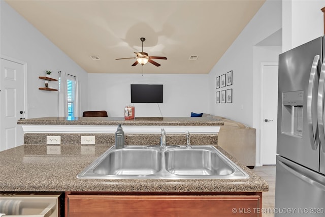 8745 S 261st E Ave, Broken Arrow, OK 74014 - kitchen featuring stainless steel fridge with ice dispenser, open floor plan, a ceiling fan, and vaulted ceiling