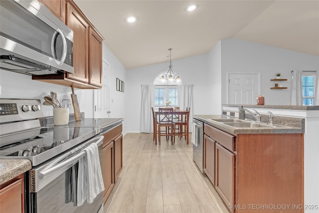 8745 S 261st E Ave, Broken Arrow, OK 74014 - kitchen featuring appliances with stainless steel finishes, vaulted ceiling, a chandelier, light wood-type flooring, and healthy amount of natural light