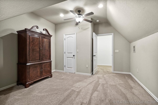11248 S 75th Ave E, Bixby, OK 74008 - unfurnished bedroom with lofted ceiling, a textured ceiling, light colored carpet, and a ceiling fan