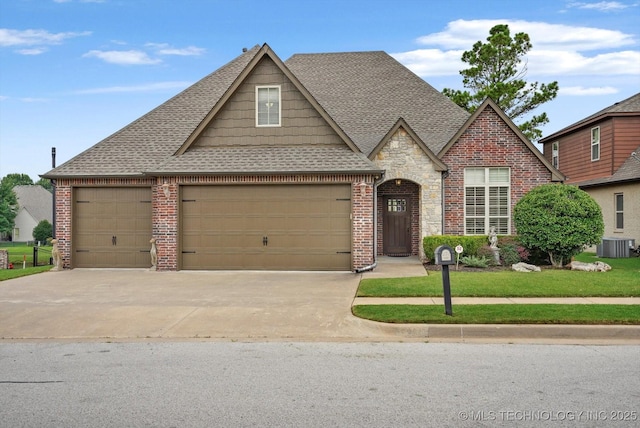 11248 S 75th Ave E, Bixby, OK 74008 - view of front of home with a garage, roof with shingles, concrete driveway, and brick siding
