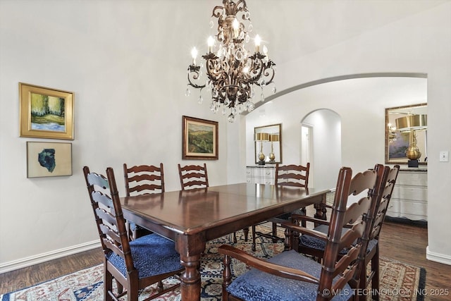 11248 S 75th Ave E, Bixby, OK 74008 - dining space with arched walkways, dark wood-style flooring, and a chandelier