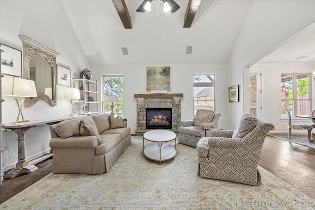 11248 S 75th Ave E, Bixby, OK 74008 - living area with wood finished floors, beamed ceiling, plenty of natural light, a fireplace, and high vaulted ceiling