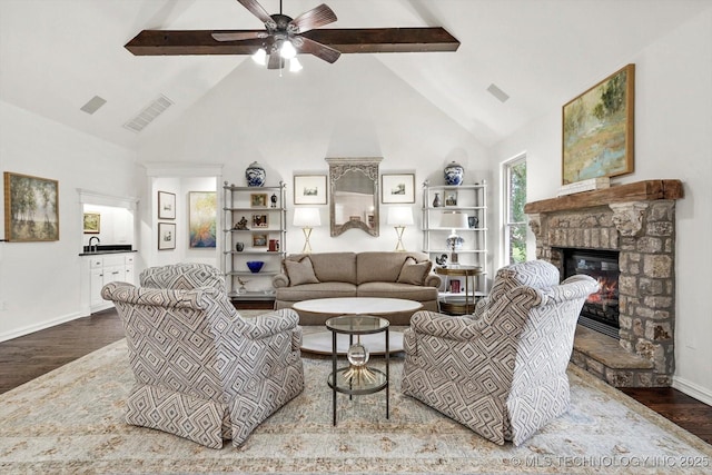 11248 S 75th Ave E, Bixby, OK 74008 - living area featuring high vaulted ceiling, wood finished floors, a fireplace, a ceiling fan, and beam ceiling