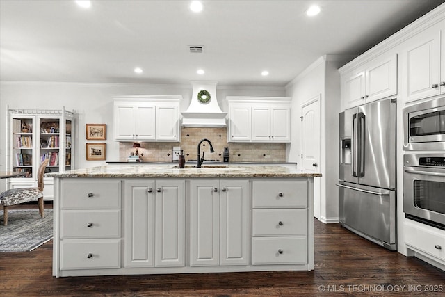 11248 S 75th Ave E, Bixby, OK 74008 - kitchen featuring stainless steel appliances, premium range hood, ornamental molding, white cabinets, and recessed lighting