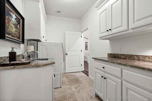 11248 S 75th Ave E, Bixby, OK 74008 - washroom featuring a sink and light tile patterned floors