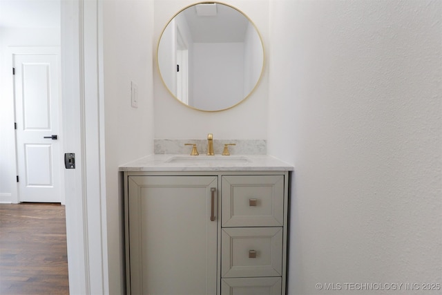 209 E Falletti Ave, Claremore, OK 74017 - bathroom featuring vanity and wood finished floors