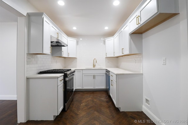 209 E Falletti Ave, Claremore, OK 74017 - kitchen with stainless steel appliances, under cabinet range hood, backsplash, recessed lighting, and light countertops