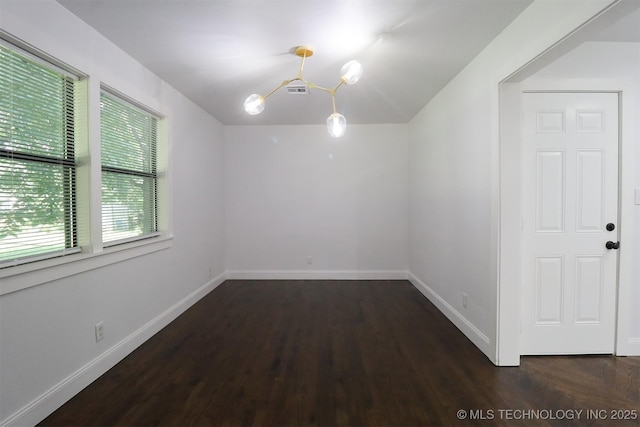 209 E Falletti Ave, Claremore, OK 74017 - unfurnished room featuring dark wood finished floors and lofted ceiling